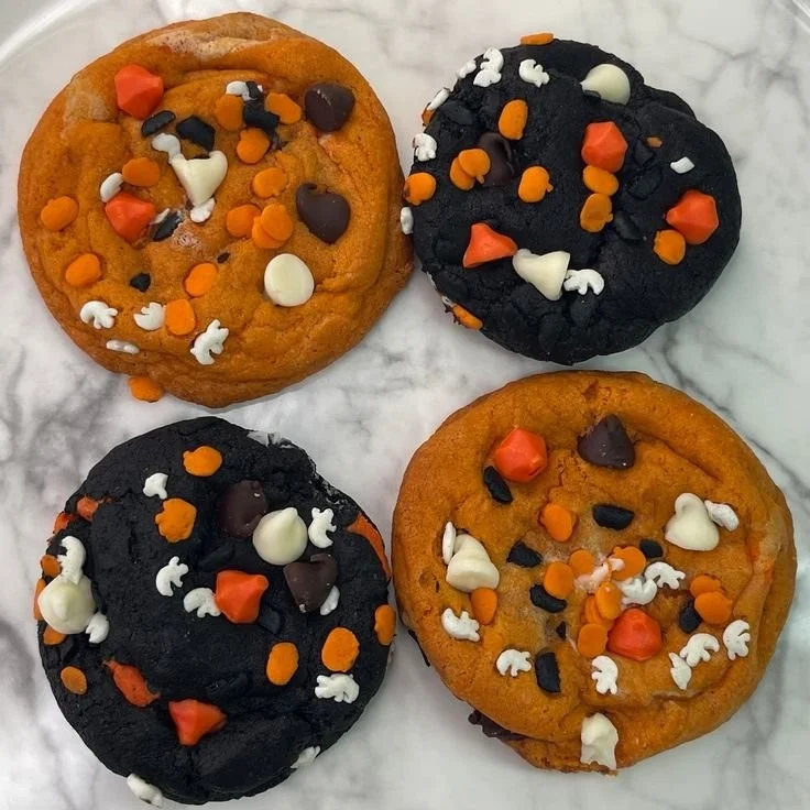 Halloween black and orange chocolate chip cookies decorated for spooky celebrations