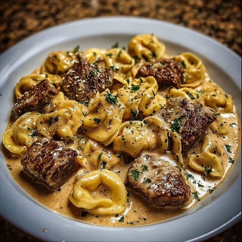 Delicious Cracked Garlic Steak Tortellini in creamy sauce served in a bowl.