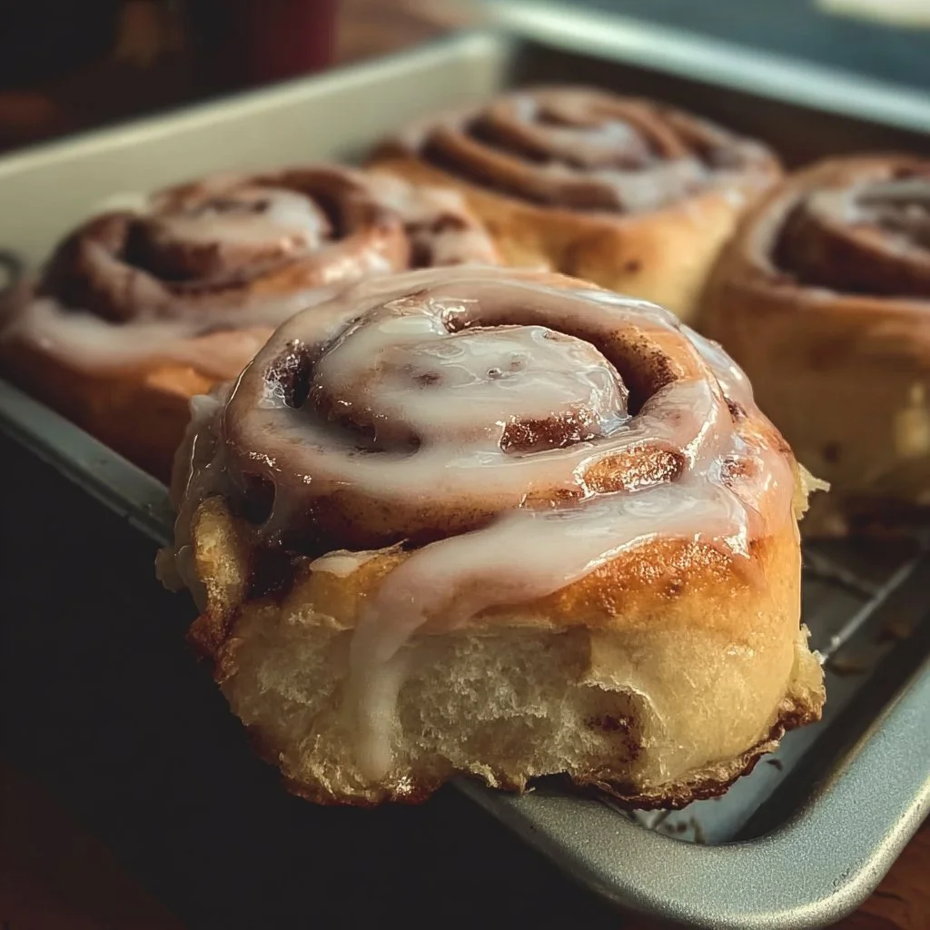 Freshly baked gluten-free cinnamon rolls with icing on top