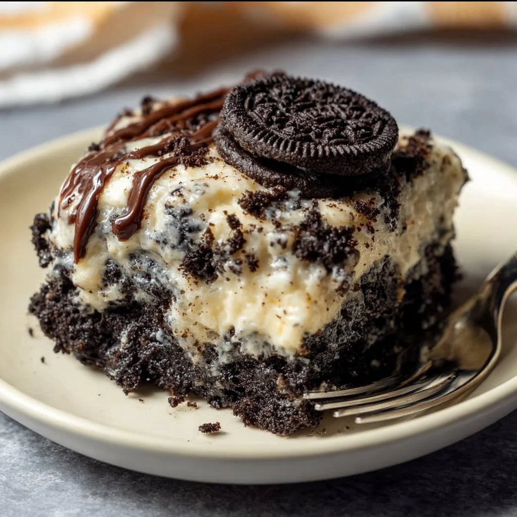 Slice of Oreo Dump Cake served on a plate with Oreo cookies around