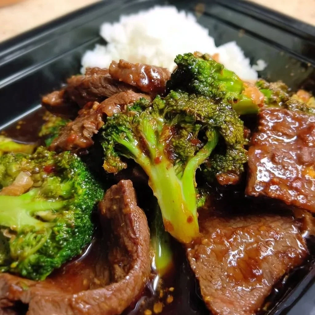 Plate of beef and broccoli stir-fry with vegetables in a savory sauce