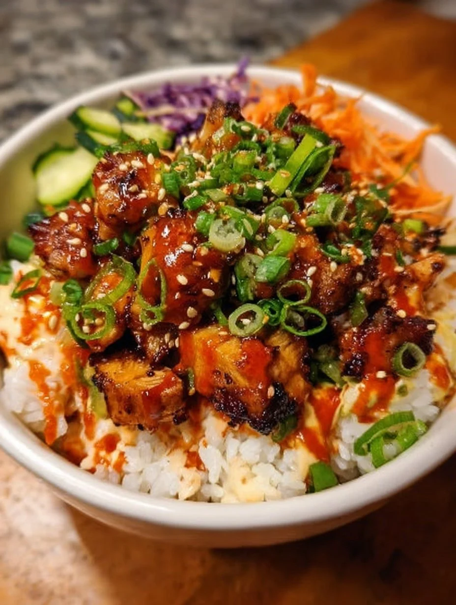 Delicious Korean BBQ Chicken Bowl topped with fresh vegetables and rice